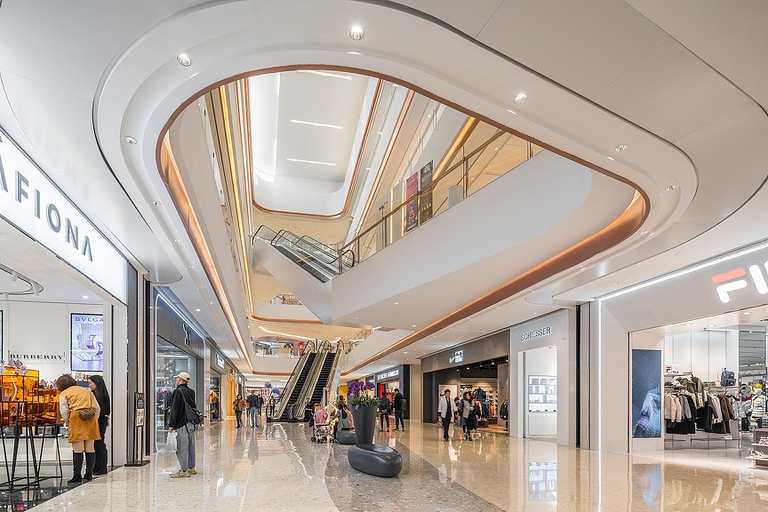 A large building with people and escalators.